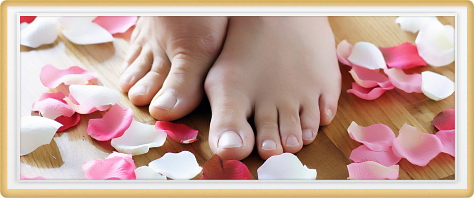 Bare feet with rose petals at Cupid Spa